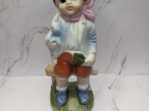 Little Boy Carrying a Bunny and Vegetables