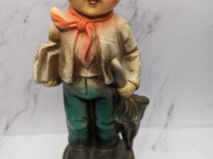 Vintage Boy Figurine Holding Books and Umbrel